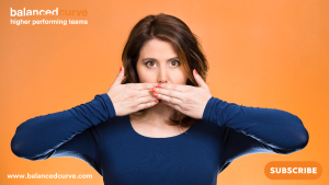 Image of a young woman wearing a blue top with hands covering her mouth preventing her from speaking